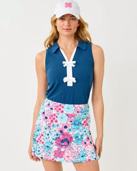 The "Starlight Navy" UPF 50+ Luxletic Frida Sleeveless Bow Polo by Lilly Pulitzer