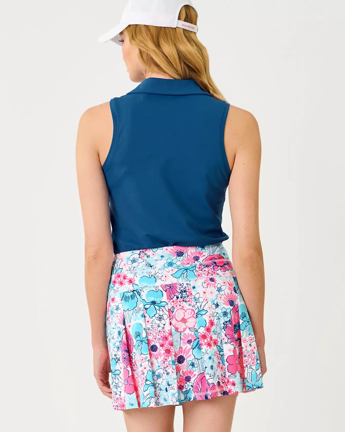 The "Starlight Navy" UPF 50+ Luxletic Frida Sleeveless Bow Polo by Lilly Pulitzer
