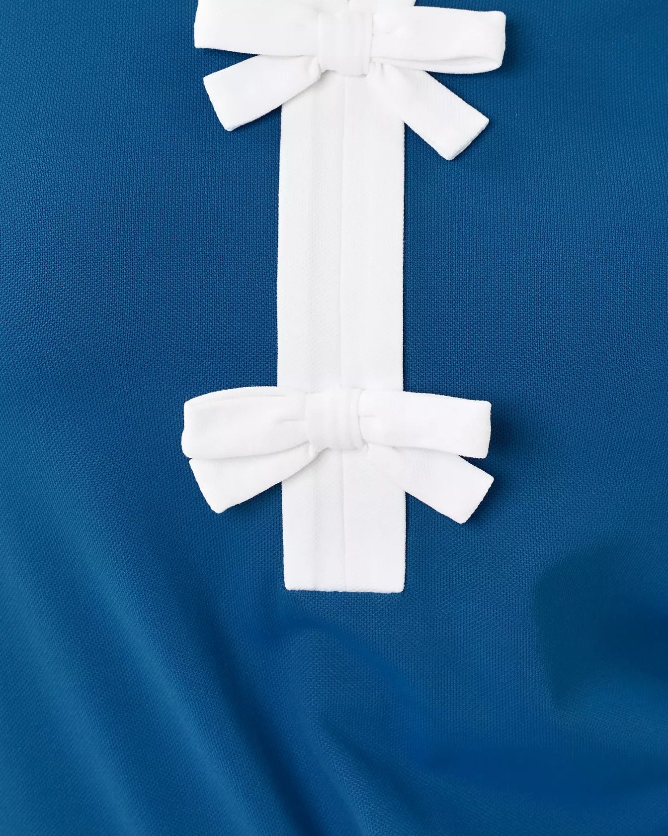 The "Starlight Navy" UPF 50+ Luxletic Frida Sleeveless Bow Polo by Lilly Pulitzer