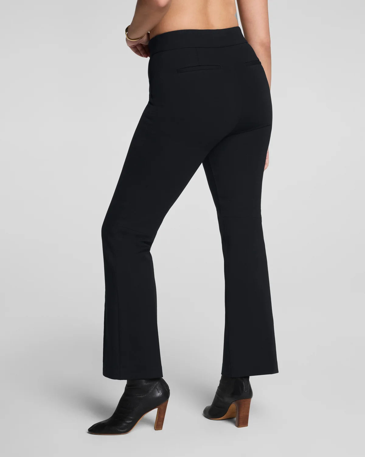 The "Classic Black" SPANXsupersmooth® PerfectFit Ponte Kick Flare Pant with Pintuck by SPANX