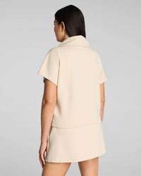The "Toasted Coconut" SPANX AirEssentials® French Rib Short Sleeve Half Zip by SPANX