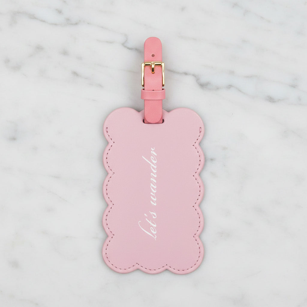 The "Let's Wander" Luggage Tag by Kate Spade